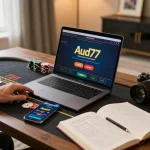 Engaging in live dealer blackjack on aud77 casino app from a cozy home setup with strategic notes.