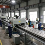 Sumwin stainless steel manufacturing facility with workers inspecting pipes and high-tech machinery.